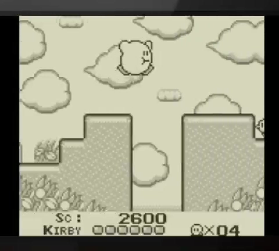 1992년 별의 커비에서 커비가 흑백 Game Boy 스테이지를 이동하는 실제 인게임 화면