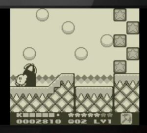 1995년 별의 커비 2에서 커비가 블록과 발판 사이를 이동하는 Game Boy 인게임 화면