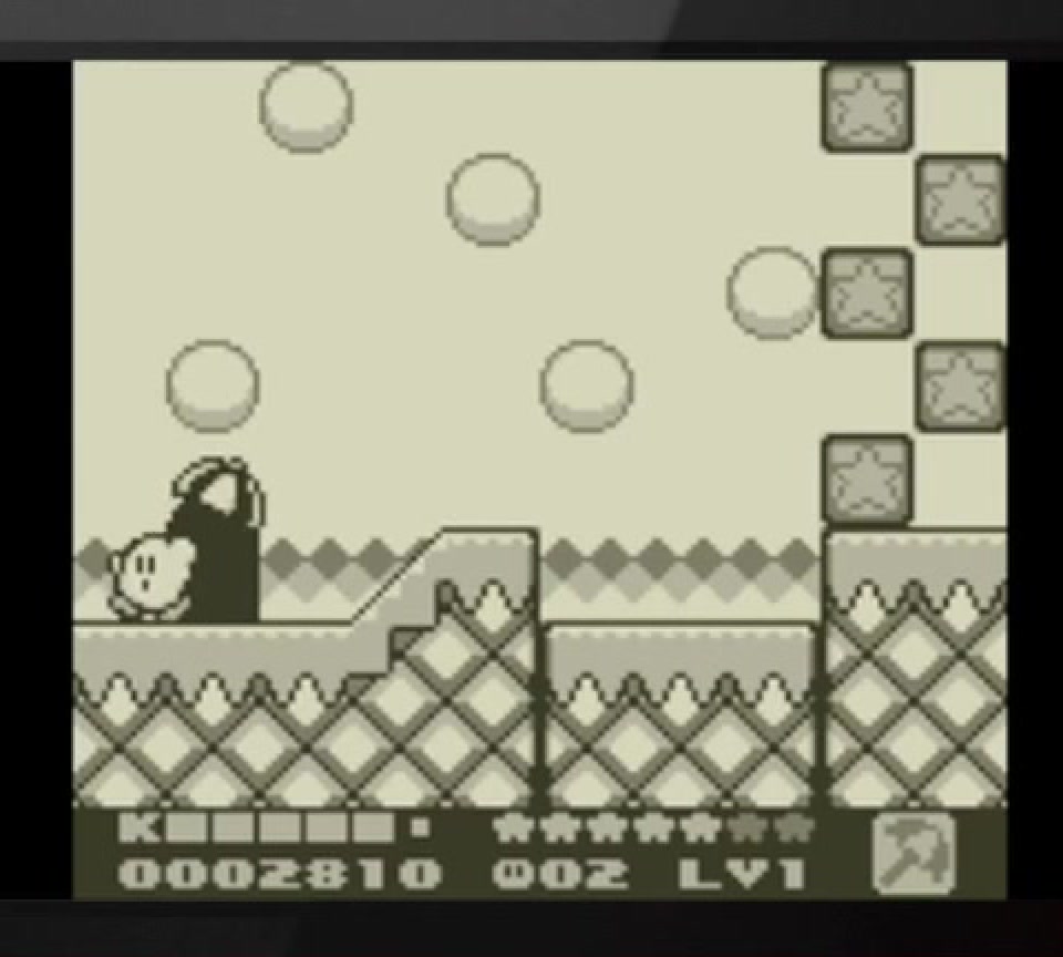 1995년 별의 커비 2에서 커비가 블록과 발판 사이를 이동하는 Game Boy 인게임 화면